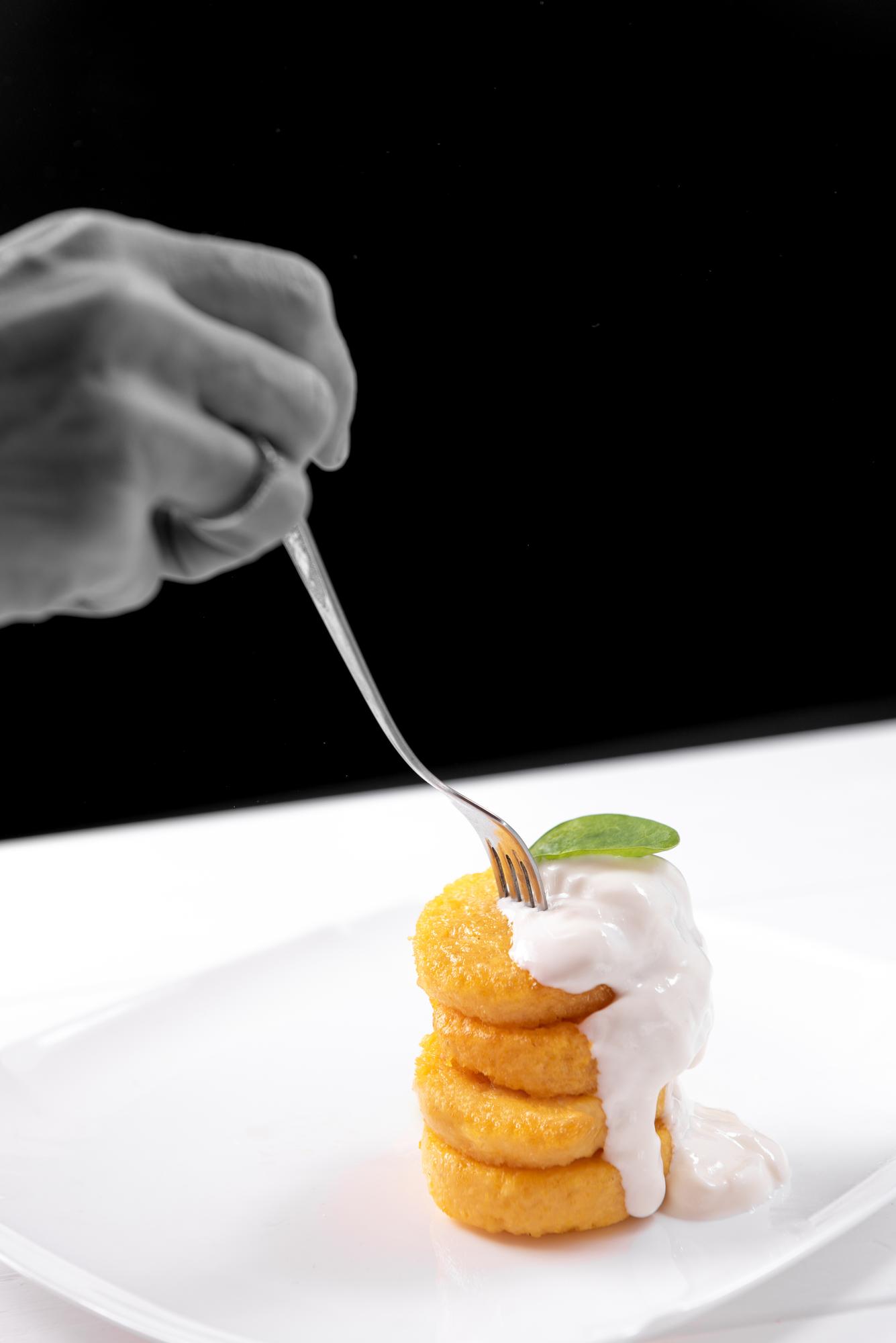 chef plating a minimalist dish