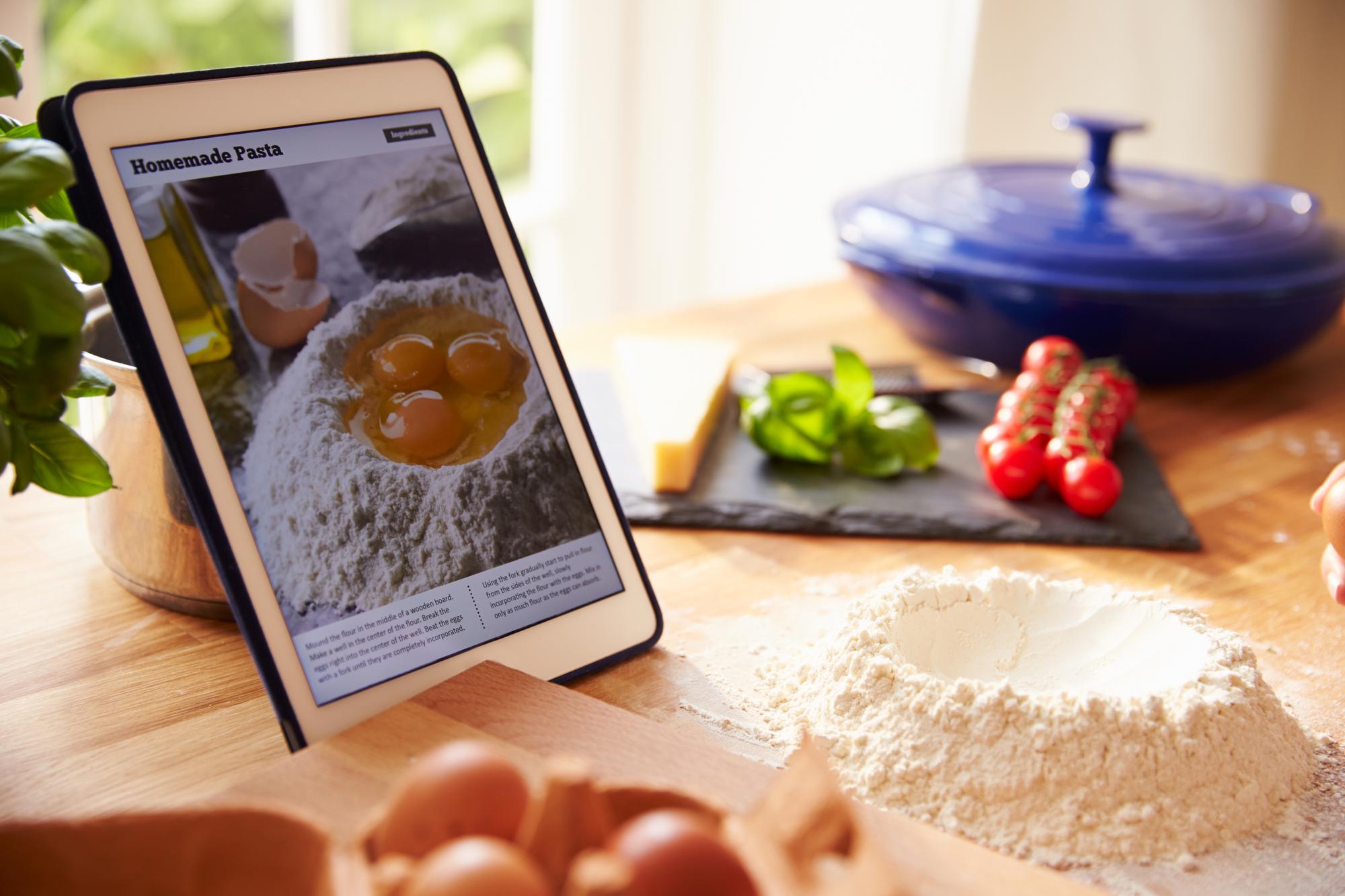 stack of recipe cards and tablet